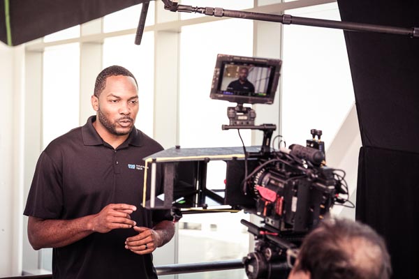 Cordero Barkley recording a promotional video for UW-Green Bay at Titletown Tech