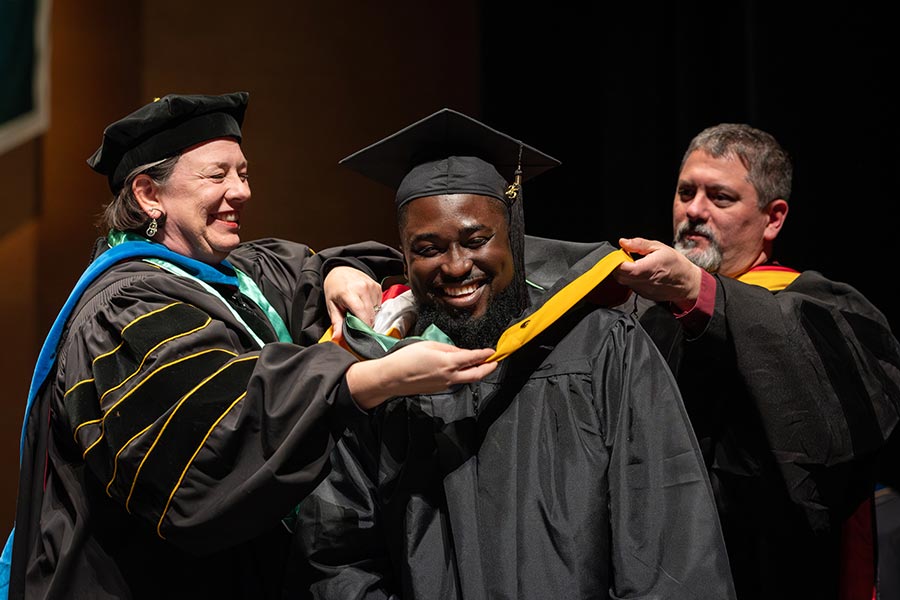 Masters Graduate receives Graduation stole