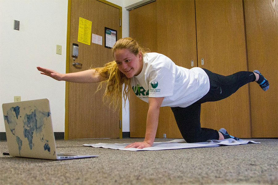 Student working out using a laptop in their on-campus housing suite