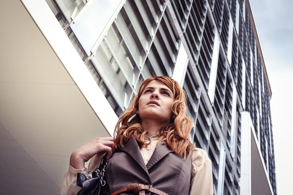 Professional woman standing outside of building