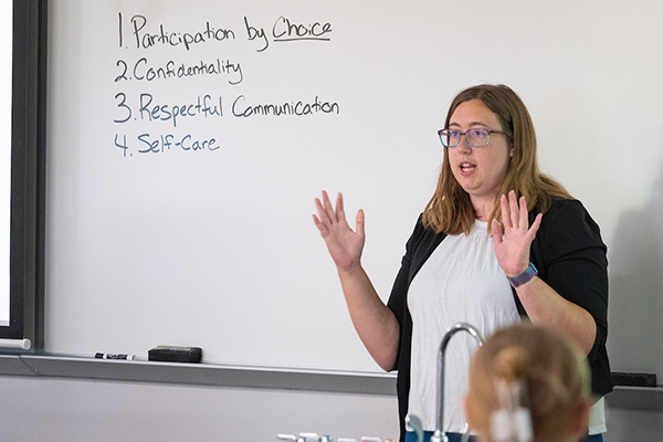 Presenter in front of whiteboard