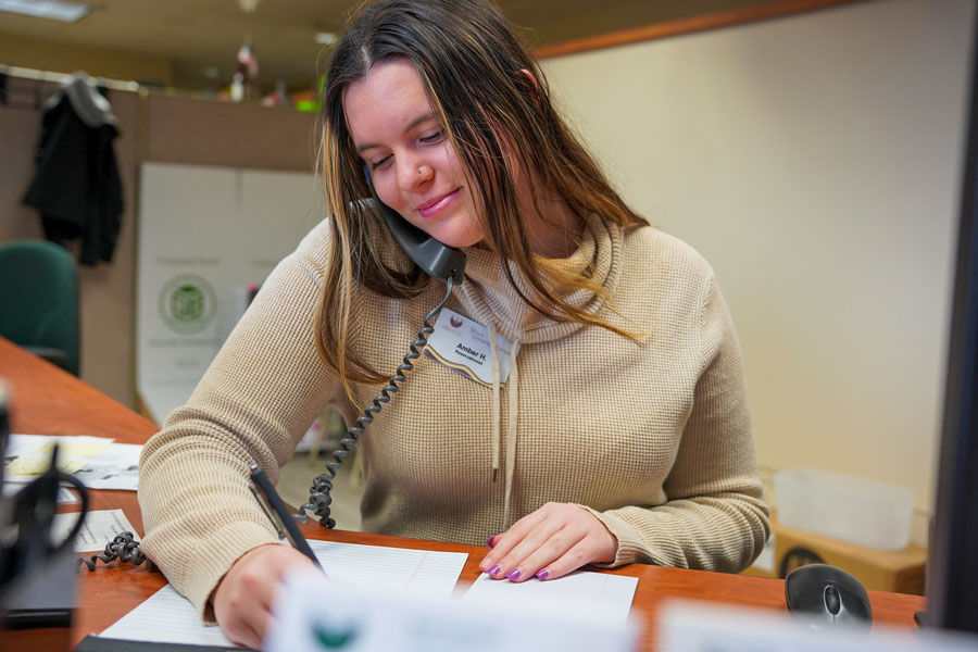 Employee on the phone working for alumni relations