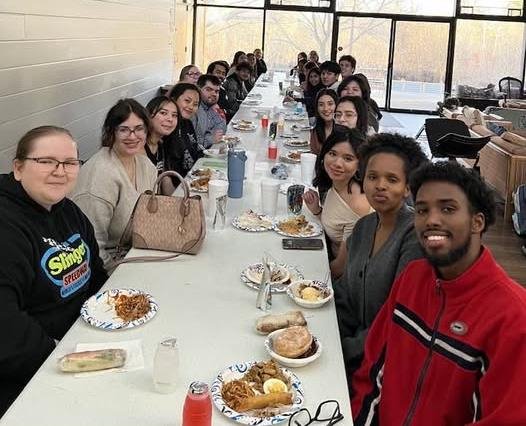 Multiple people sitting at a table for dinner