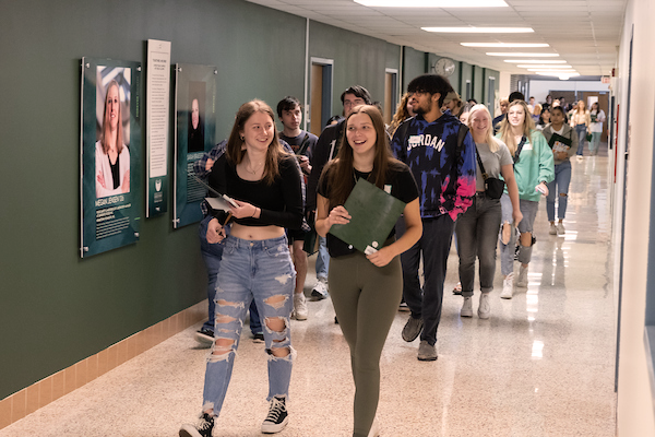 group of students walking in the hallway