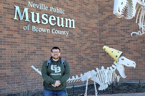 Intern in front of Neville Museum