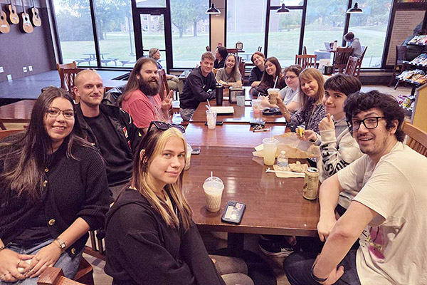 Large group discussion in cafe